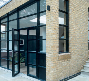 Customised black glazing bars door for a period home