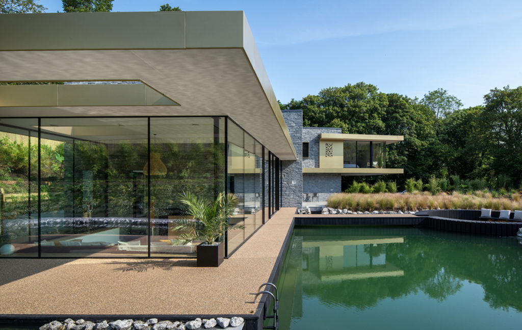 Swimming pool accessed by large sliding doors 