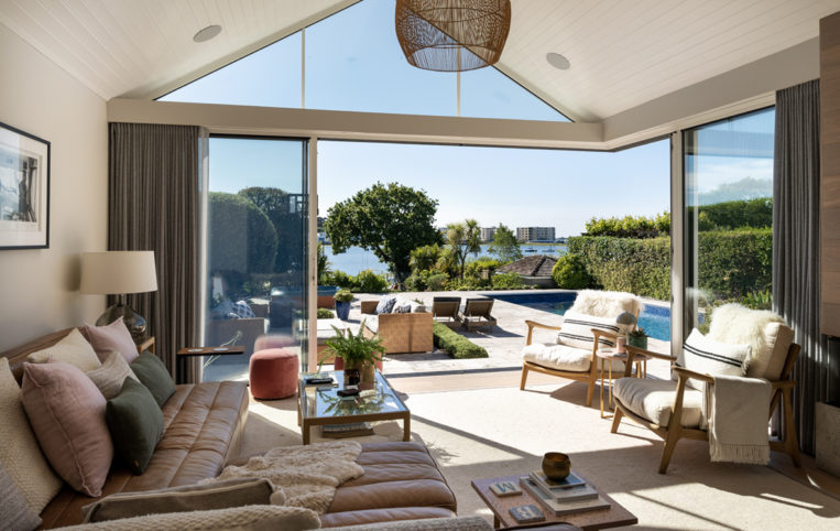 Sunlit living room with open corner slding doors