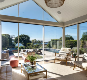 Cool shaded living space with views through full height sliding doors