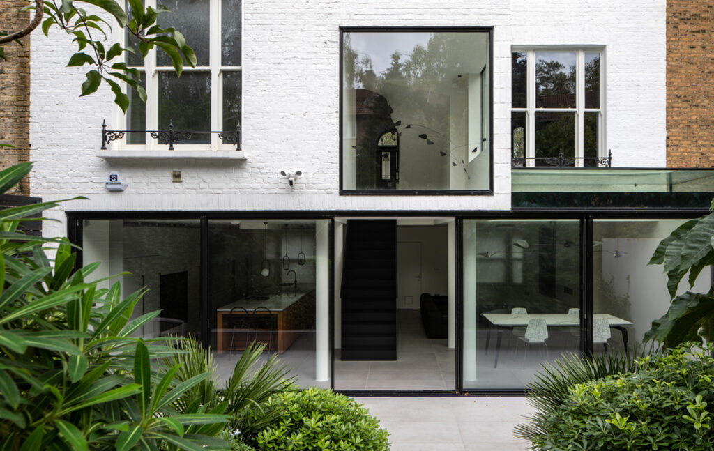 Exterior renovated terraced city home with sliding doors