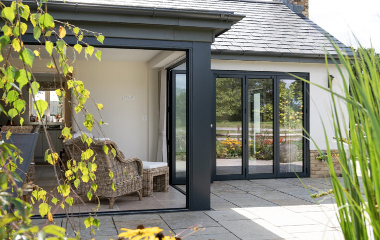 Concertina folding doors open out onto patio