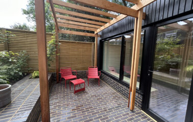 Brick patio complements vertical timber cladding